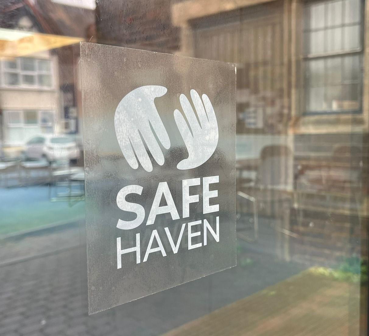 Safe haven logo in a shop window