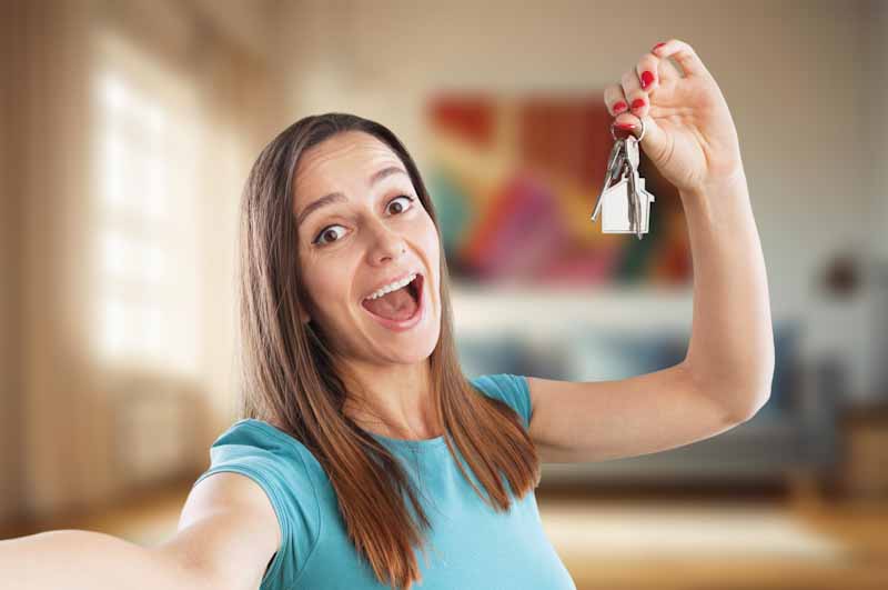 Young adult with house keys